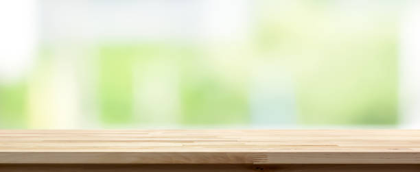 istock Wood table top on  abstract white green background, panoramic banner 1036416712