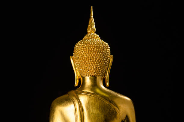 istock Golden buddha statue isolated on black background 1036444670