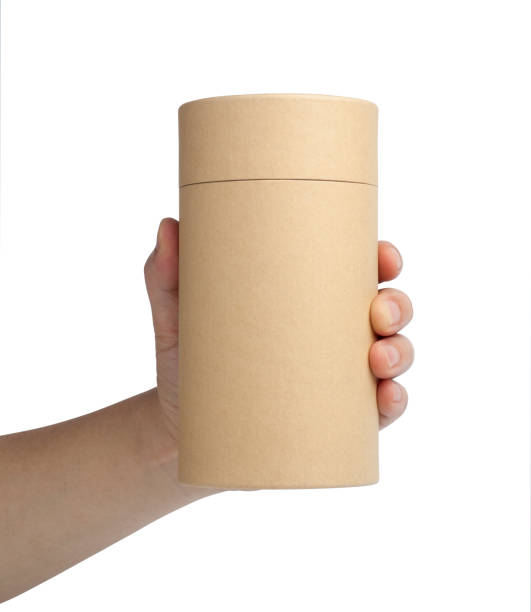 istock A man's hand holding a brown paper tube 1036465280