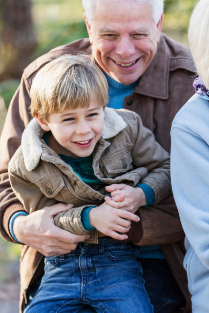 istock Boy with grandfather on playground 1036469386