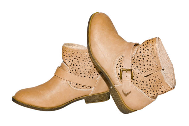 istock Women's genuine leather ankle boots with linen fabric on isolated background. 1036473074