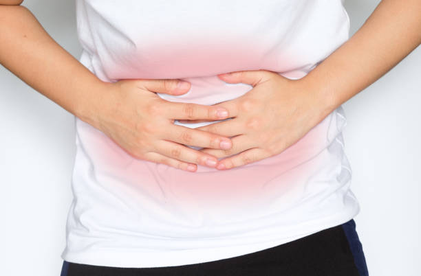 istock Man suffering from abdominal pain on white background 1036487790