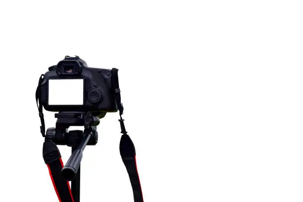 Photo of Camera on tripod photographers take clipping path work Isolated white background