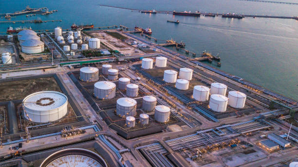 aerial view oil terminal is industrial facility for storage of oil and petrochemical products ready for transport to further storage facilities. - storage tank imagens e fotografias de stock