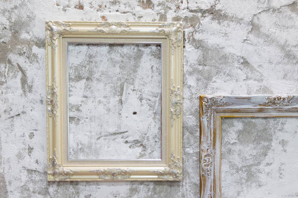 istock empty vintage photo frame on old dirty concrete wall. 1036515608