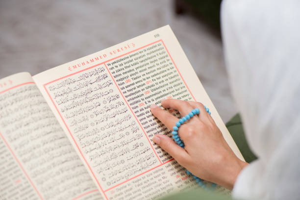 istock Muslim Woman Reading Koran 1036529804