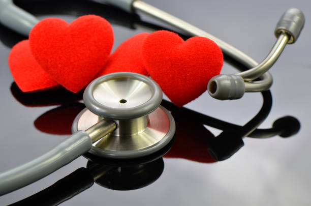 istock Heart and stethoscope on dark background. 1036533152