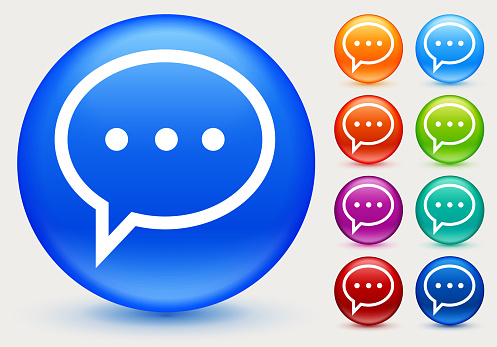 Chat Bubble Icon. The icon is white and is placed on a round blue vector button. The button has a sight shadow and the background is light. The composition is simple and elegant. The vector icon is the most prominent part if this illustration. There are eight alternate button variations on the right side of the image. The alternate colors are orange, red, purple, maroon, light blue, green, teal and indigo.