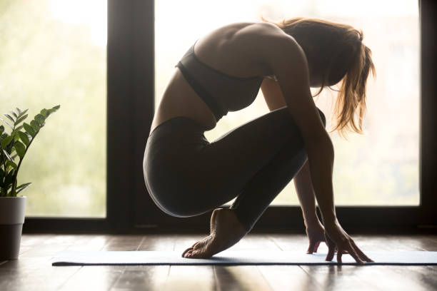 istock Young sporty woman practicing foot strengthening exercise 1036550438