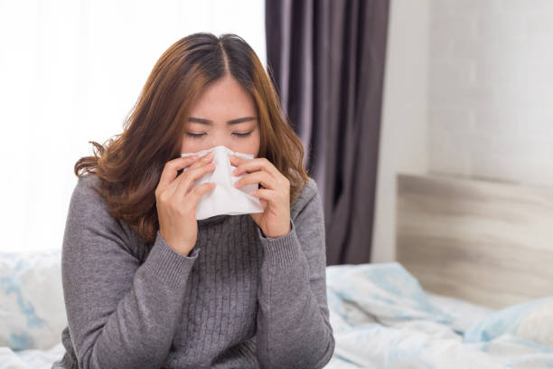 istock Women have sneezing because of colds 1036553456