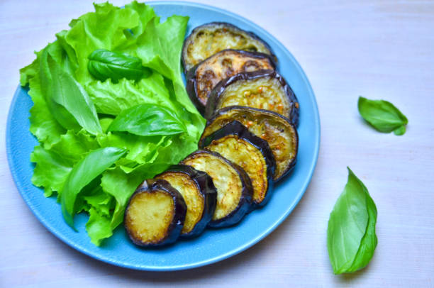 istock fried eggplant with lettuce and Basil leaves 1036556212