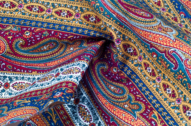 istock Background texture, pattern. Cotton fabric, dyed Paisley. this delightful collection of cotton prints contains bizarre prints with bohemian talent and rich color tracks. 1036559382