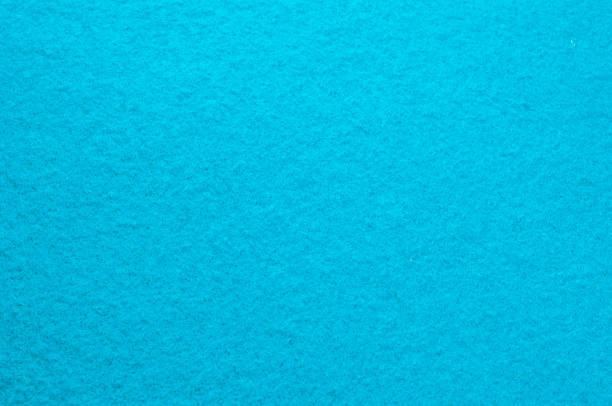 istock Background texture, pattern. Woolen fabric is turquoise. Felt. Close up view of a turquoise fabric texture and background. Abstract background and texture for designers. 1036559438