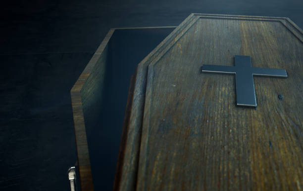 Open Coffin A slightly open empty wooden coffin with a metal crucifix and handles on a dark ominous background - 3D Render coffin stock pictures, royalty-free photos & images