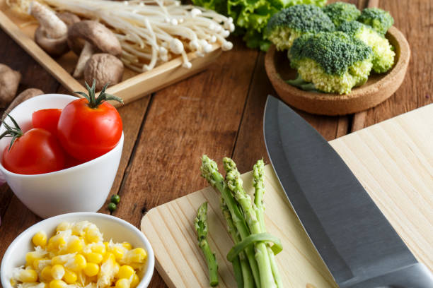 istock Fresh vegetable cooking ingredients on rustic wooden table 1036563512
