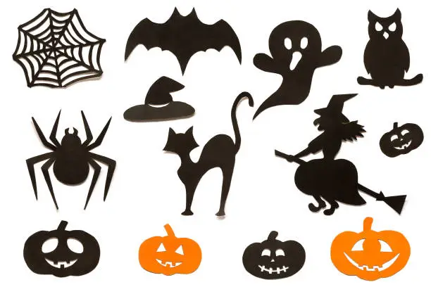 Photo of Happy Halloween Set silhouettes cut out of black orange paper isolated on white background.