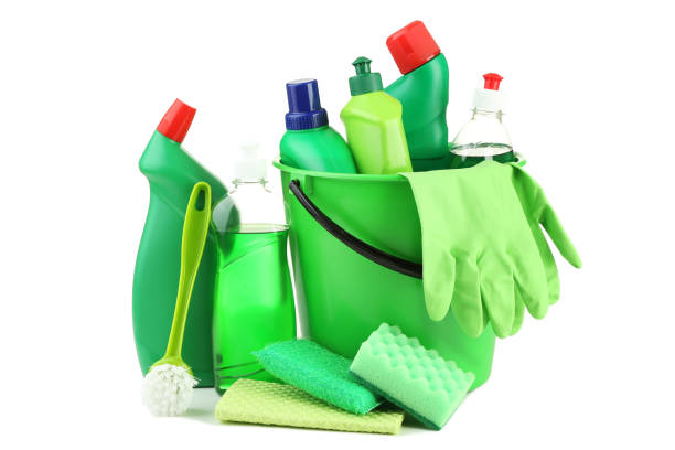 istock Bottles with detergent and cleaning tools on white background 1036573878