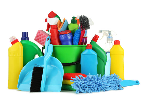 istock Bottles with detergent and cleaning tools on white background 1036573948