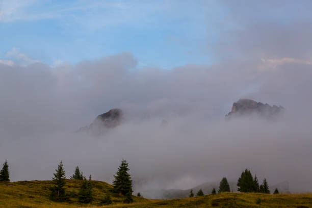 istock Dramatic sunset colors and rain clouds in the Dolomite Mountains, Italy 1036578288