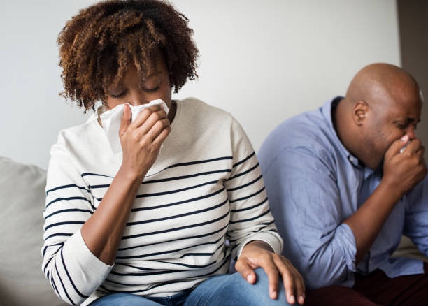 istock Woman sick and sneezing 1036586424