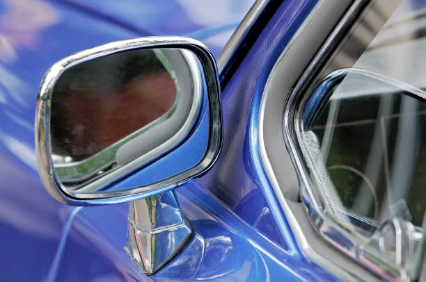 istock Car mirror in a chrome casing on a blue car 1036587102