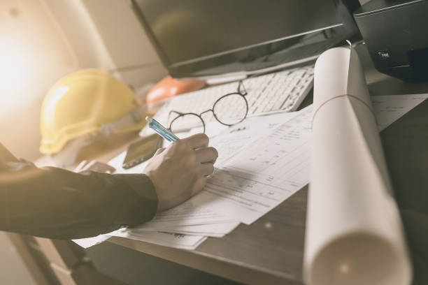 istock Hands of Engineer working on blueprint. Engineering tools. Vintage tone. 1036590446