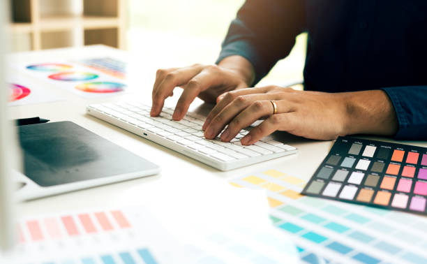 istock Graphic designer typing keyboard on desk in modern office. 1036590934