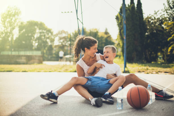 istock Mother and her son at playground have fun . 1036598760