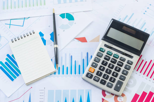 istock Calculator with notebook on Business Graphs finance document. 1036602140