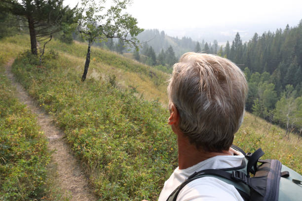 istock View past man's upper torso to trail ahead 1036606934