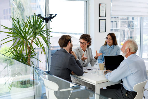 istock Business people having board meeting in modern office 1036615158