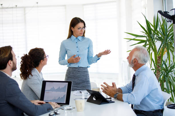 istock Partners discussing their business development in a meeting 1036615740