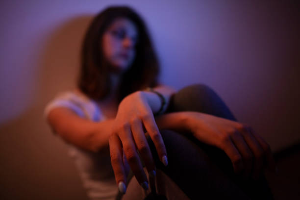 istock Young woman alone and depressed 1036616814