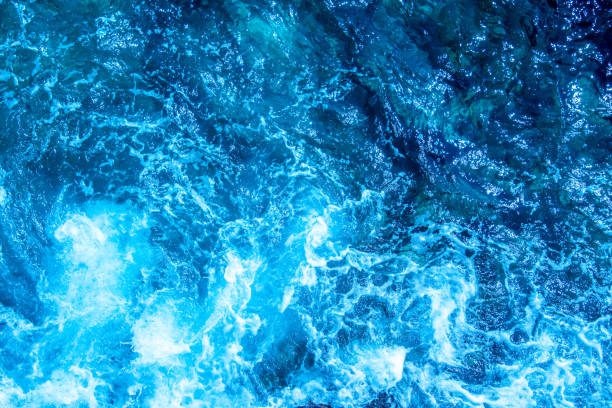 istock Blue deep sea foaming water background 1036617460