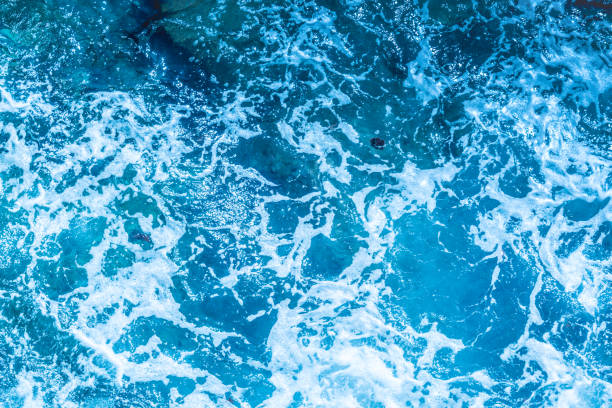 istock Blue deep sea foaming water background 1036621060