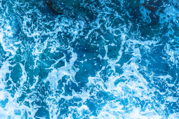 istock Blue deep sea foaming water background 1036621286