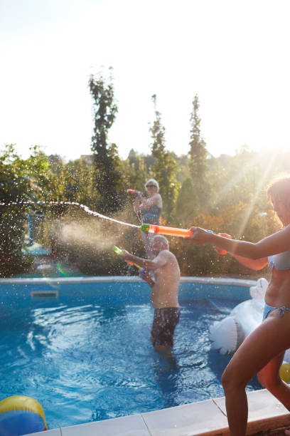 istock Seniors On Pool Water Fight 1036626164