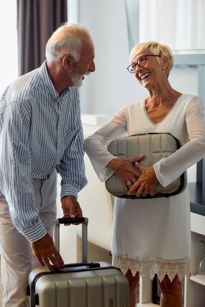 istock Senior Couple In Hotel 1036626736