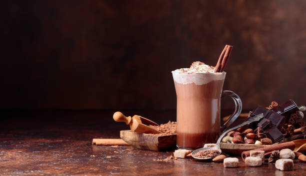 istock Cocoa with cream, cinnamon, chocolate pieces and various spices. 1036628136