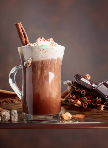 istock Cocoa with cream, cinnamon, chocolate pieces and various spices. 1036628450