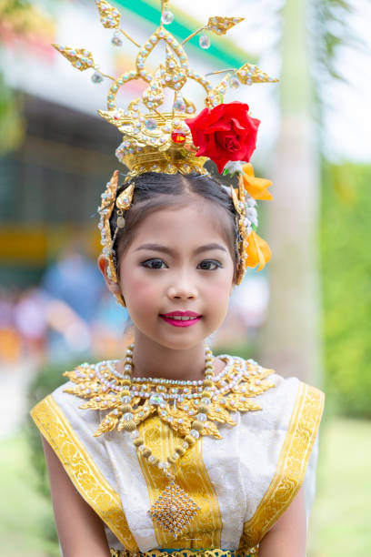 Thai girl in tradition dress a cute Thai girl in traditional dress to perform Thai drama dance dramatise stock pictures, royalty-free photos & images