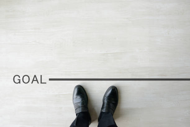 istock Business man standing on goal line 1036636860
