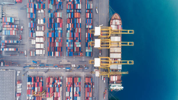 istock Aerial view container ship from sea port warehouse waiting for delivery containers shipment. Suitable use for transport or import export to global logistics concept. 1036637524