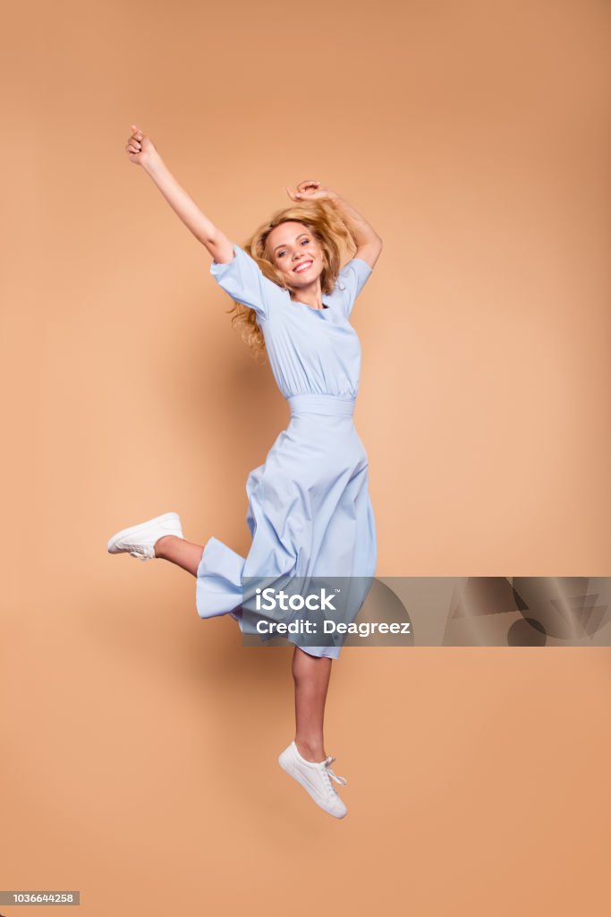Vertical full length body size studio photo portrait of cute cool free fresh charming pretty attractive lady in light blue clothing feeling expressing happiness isolated bright pastel soft background Women Stock Photo