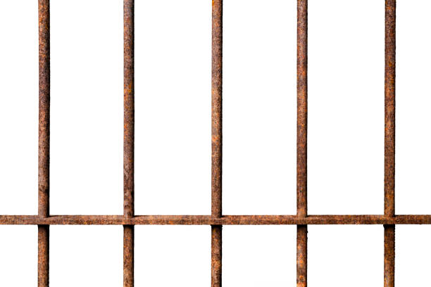Old prison rusted metal bars cell lock isolated on white backgroun Old prison rusted metal bars cell lock isolated on white background, concept of strengthen and protect rusty fence stock pictures, royalty-free photos & images