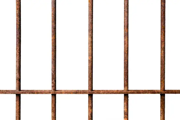 Photo of Old prison rusted metal bars cell lock isolated on white backgroun