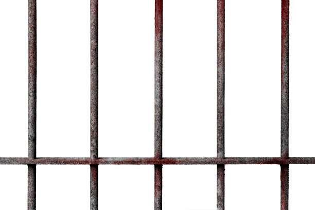 istock Old prison rusted metal bars cell lock with blood stain isolated on white background 1036645346