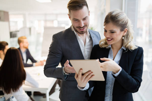 istock Group of business people collaborating in office 1036650190