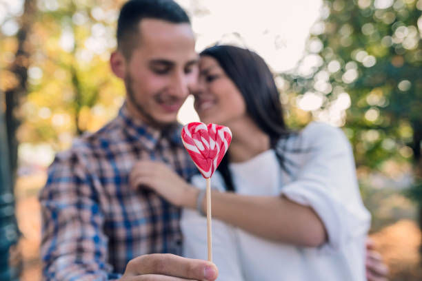 istock Couple with lollypop 1036651132