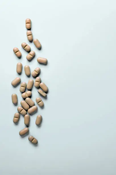 Photo of Natural Supplements scattered on a light background